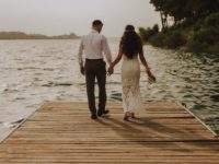 photo-of-couple-standing-on-wooden-planks-2403568